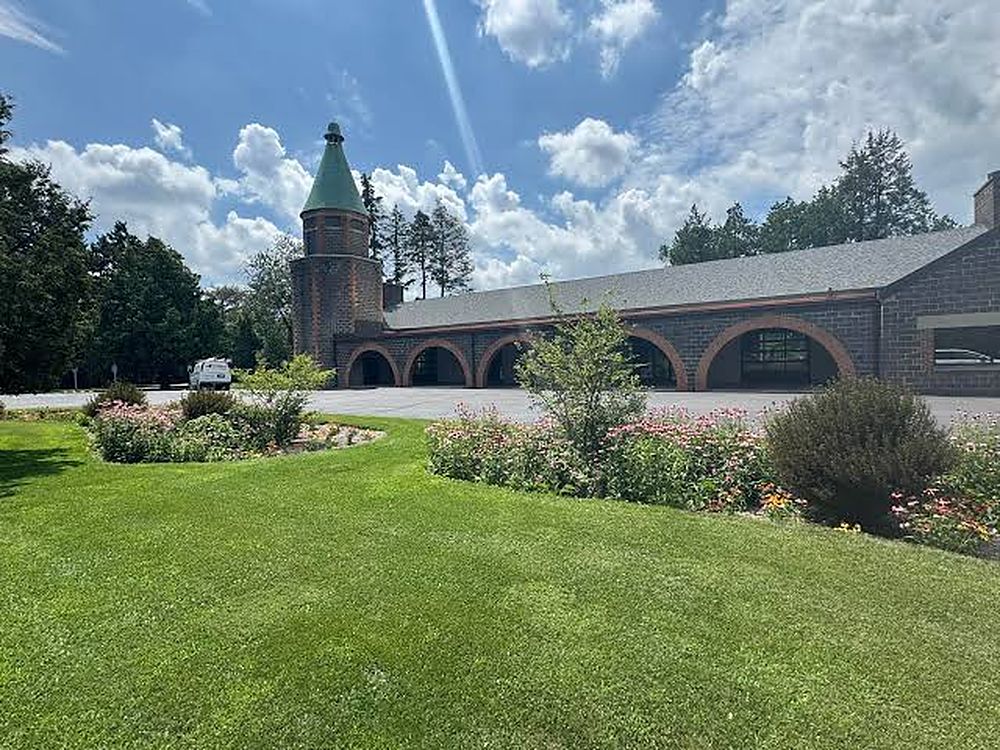 Brady Lodge with gardens and lawn