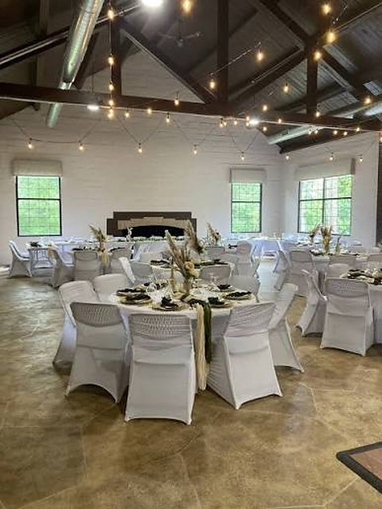 Great hall set for a reception under string lights