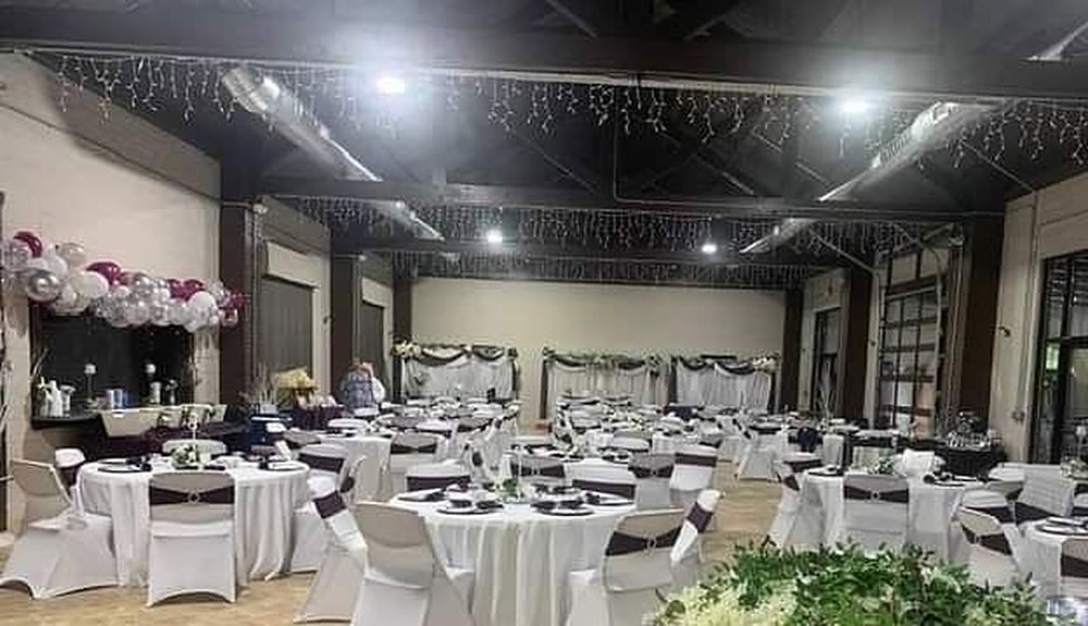 Reception with draped tables and balloon décor